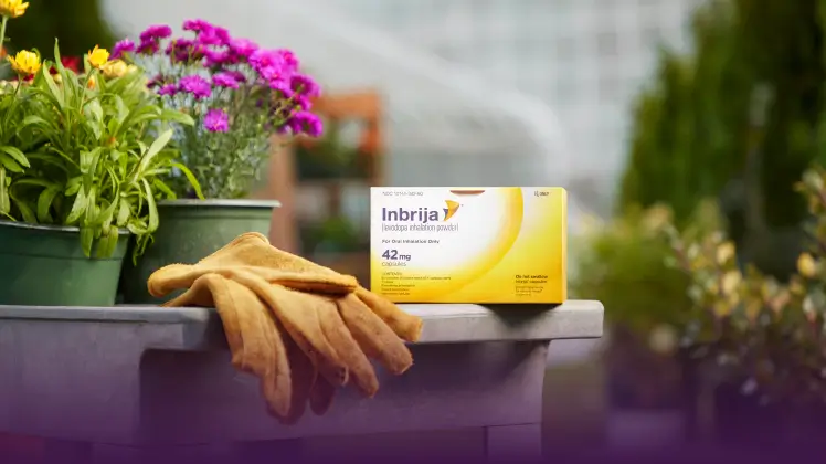 The Inbrija packaging on a gardening table