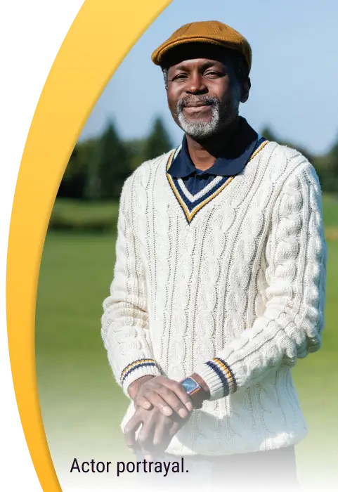 Portrait shot of Stephen standing at the golf course